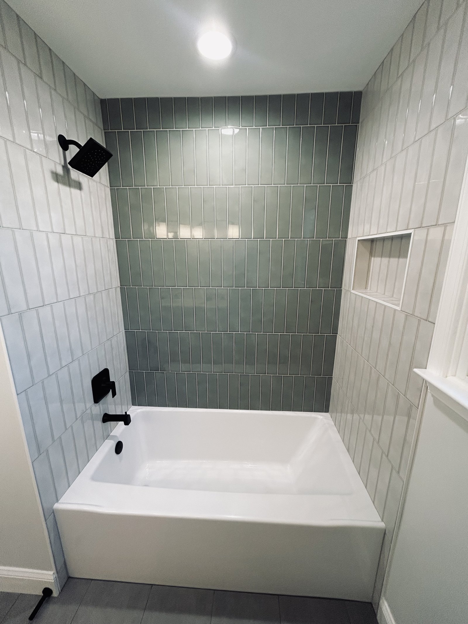 Tub shower green accent tile black fixtures West Chester